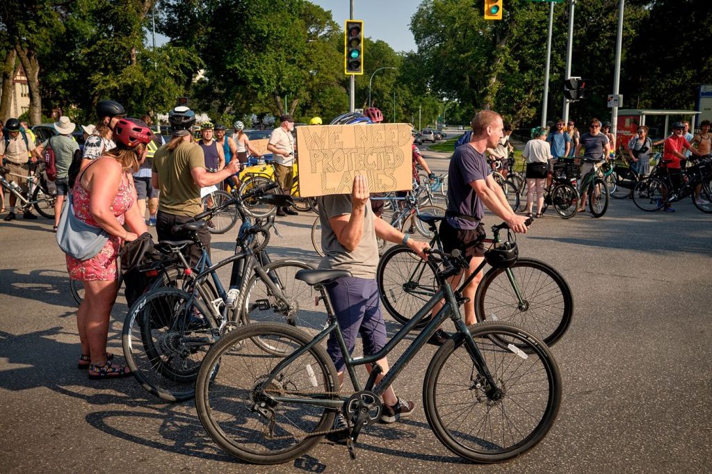 cyclists using a protected bike lane